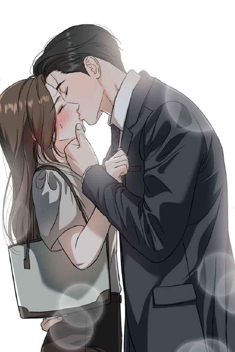 Hai người hôn nhau trong phòng ngủ sang trọng.